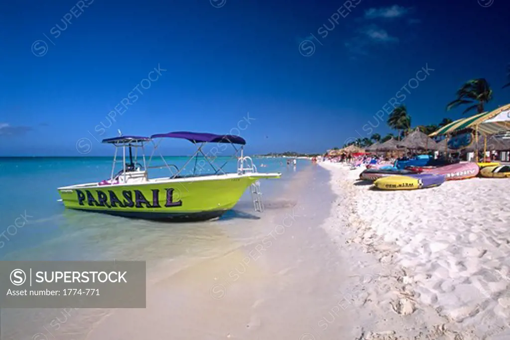 Dutch Antilles, Aruba, Eagle Beach View with Boat and Palapas