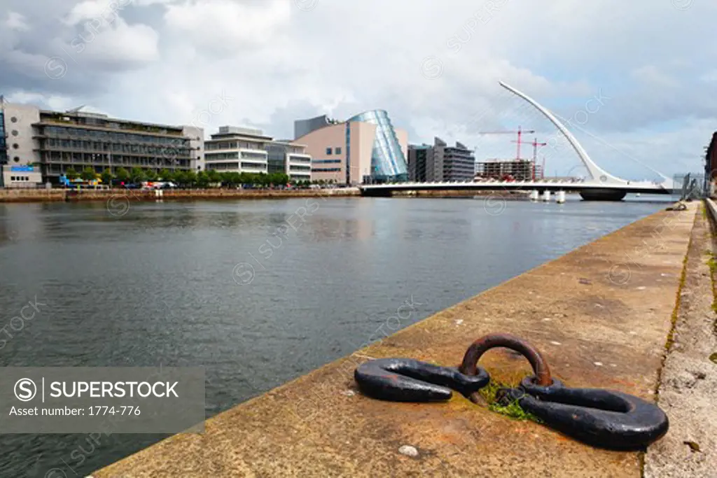 Republic of Ireland, Dublin, Low Angle View of Quay on Liffey River with Samuel Beckett Bridge