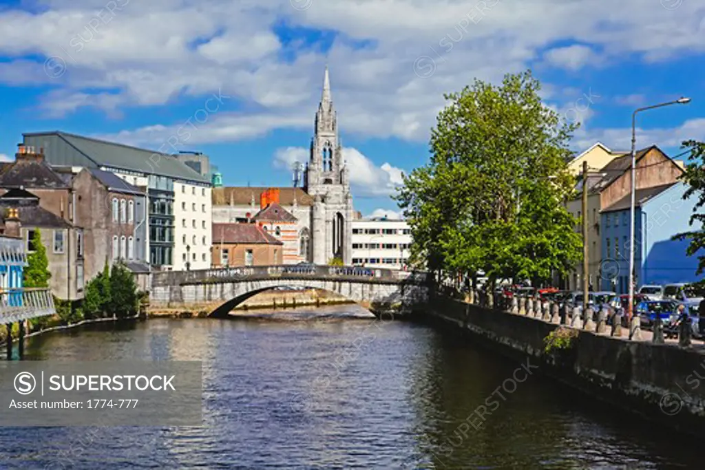 Republic of Ireland, County Cork, Cork City, View of River Lee with Holy Trinity Church in Background