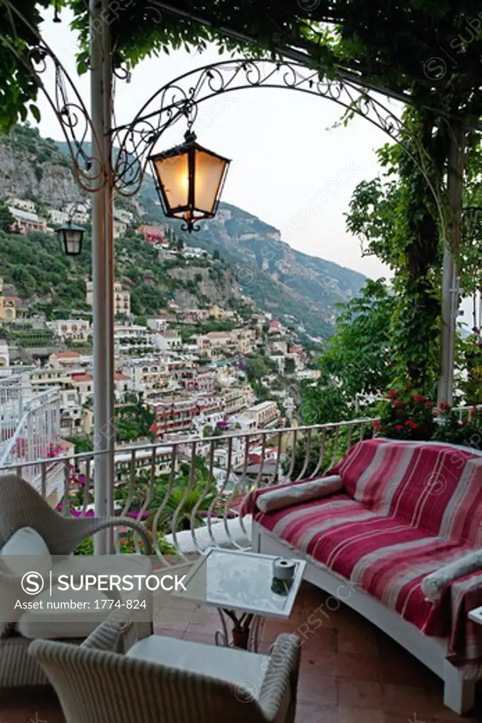 Italy, Campania, Positano, Armchairs and sofa on hotel balcony