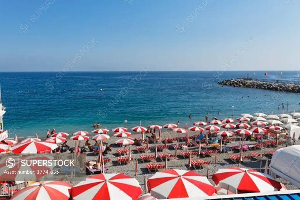 Italy, Campania, Amalfi, Beach with rows of beach umbrellas and chairs