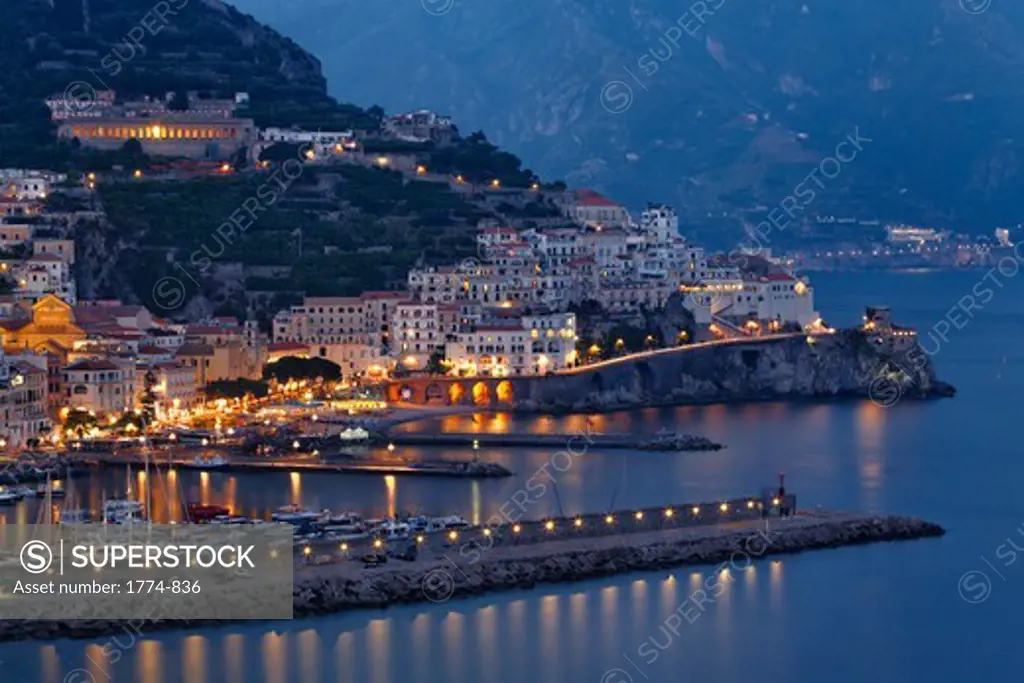 Italy, Campania, View of Amalfi Town with harbor at night
