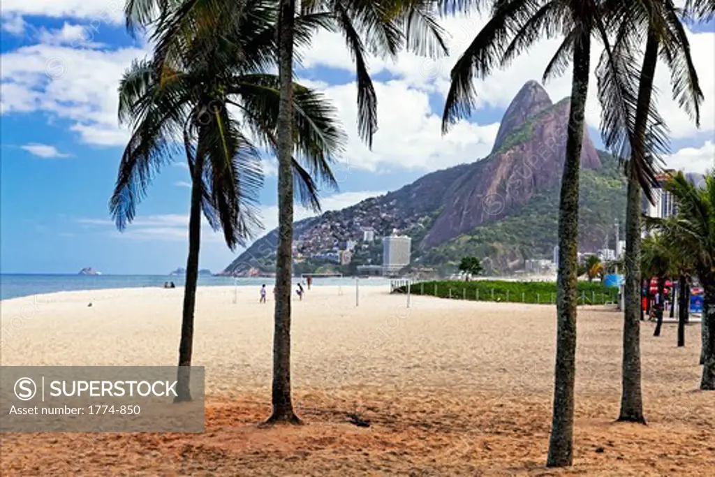 Ipanema Beach viewed through palm trees, Rio De Janeiro, Brazil