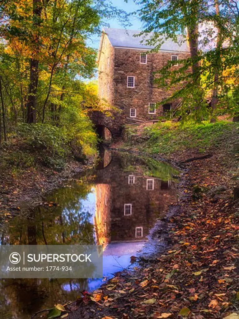 Old mill reflected in a creek, Cooper Mill, Chatham, Morris County, New Jersey, USA