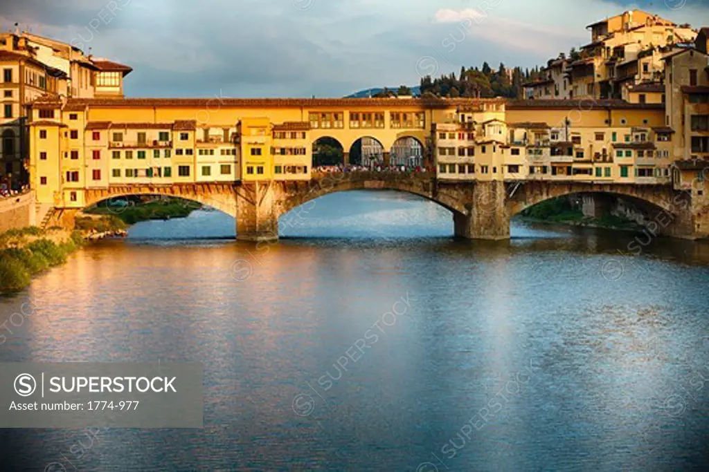 Italy, Tuscany, Florence, Golden light on Ponte Vecchio