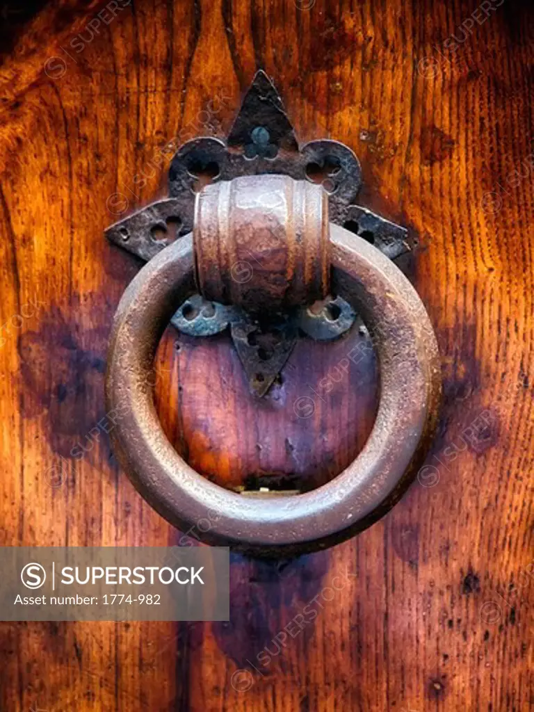 Italy, Tuscany, Florence, Close up view of old 15th century door knocker