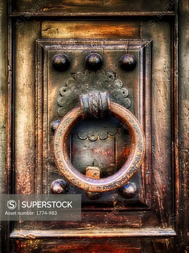 Italy, Tuscany, Florence, Close up view of antique renaissance door knocker