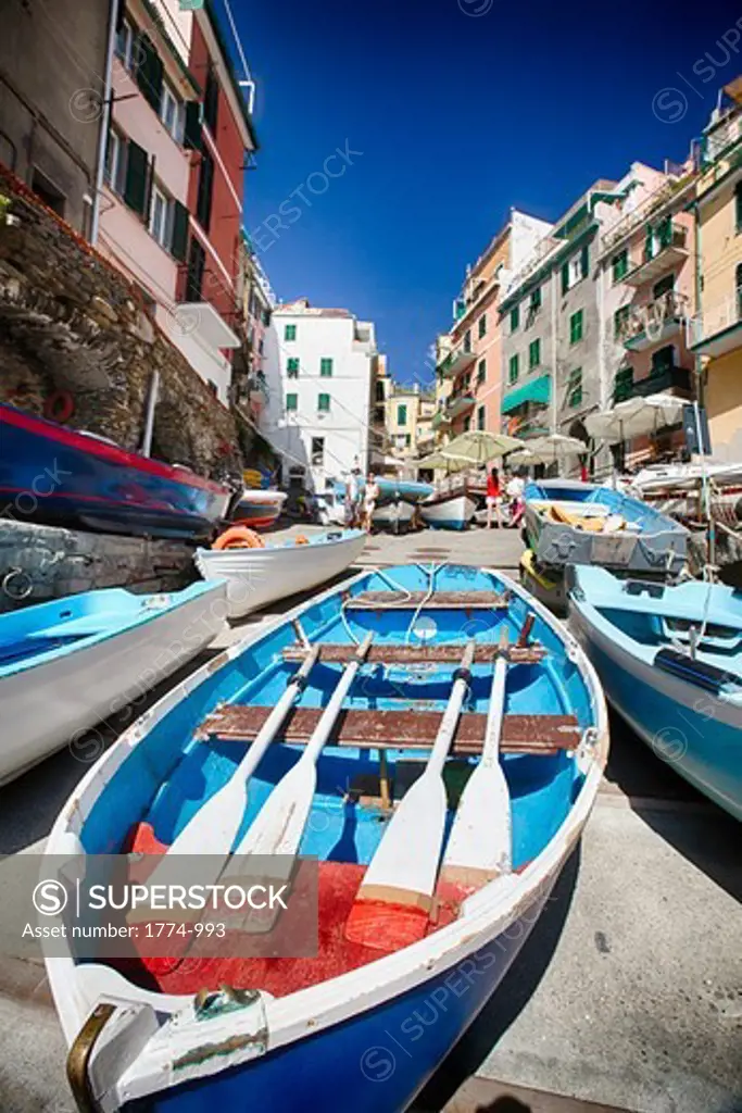 Italy, Liguria, CinqueTerre, Riomaggiore, Low angle view of traditional row boats on dock