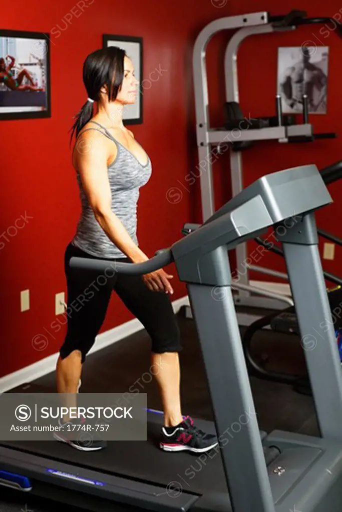USA, New Jersey, Fit Mid Adult Woman Exercising on Treadmill