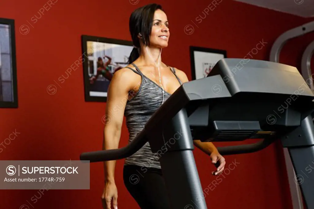 USA, New Jersey, Low Angle Close Up View  of Fit Mid Adult Woman Exercising on Treadmill
