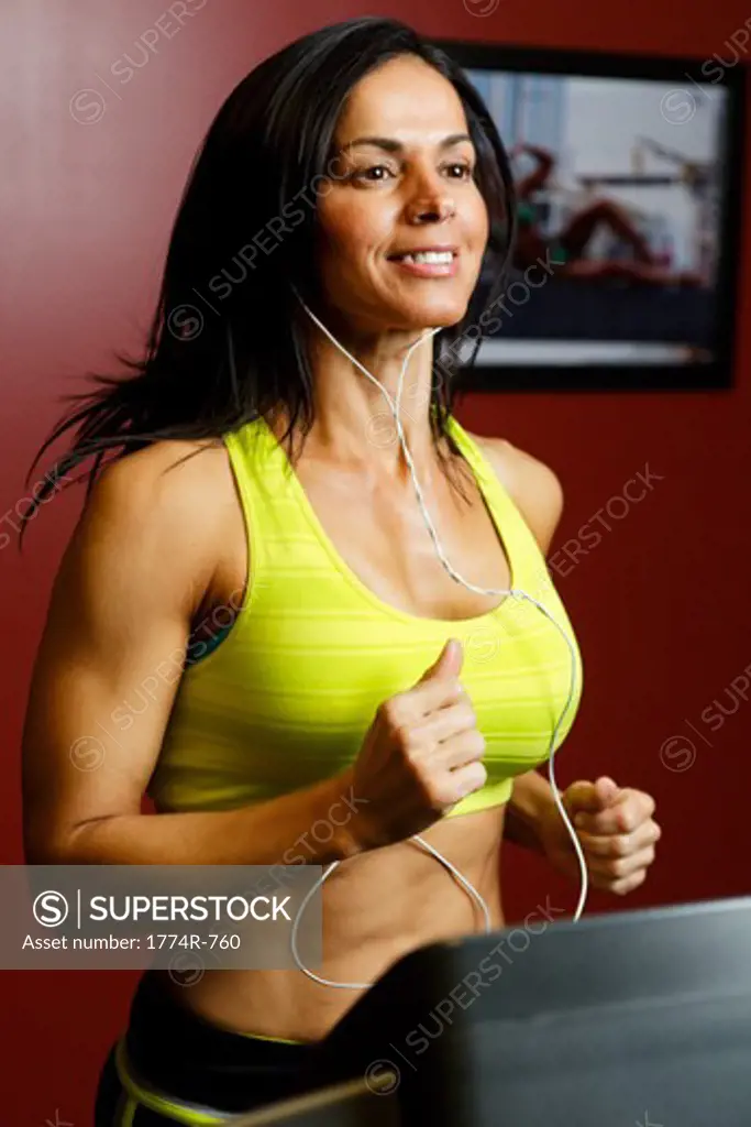 USA, New Jersey, Close Up View of Fit  Woman Running  on Treadmill