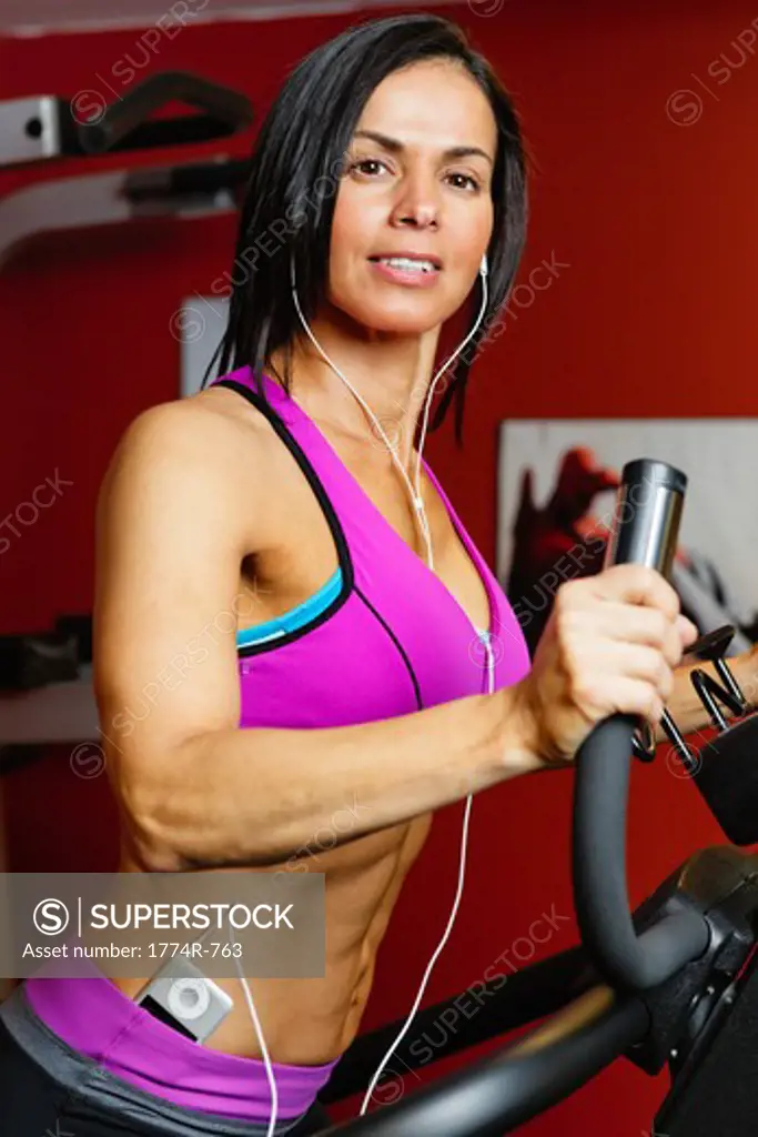 USA, New Jersey, Low Angle Close Up  View of Fit  Woman Exercising on Setpmaster