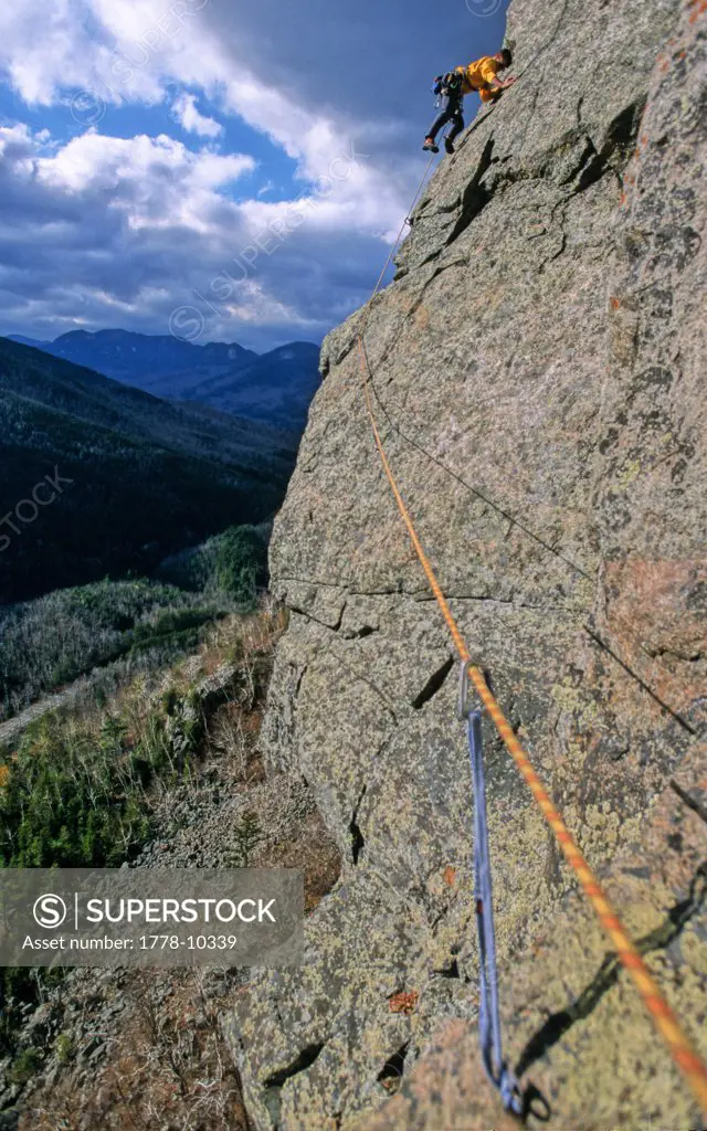 A man rock climbs on lead in Adirondack State Park near Lake Placid, NY
