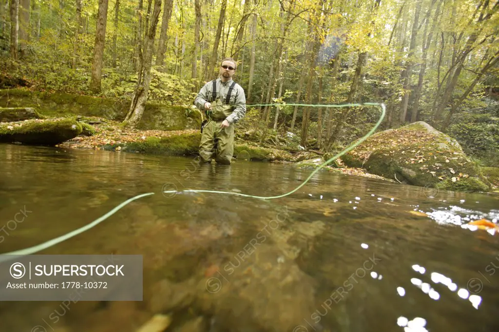 Male fly-fisherman under fall colors in the Great Smoky Mountains National Park, NC