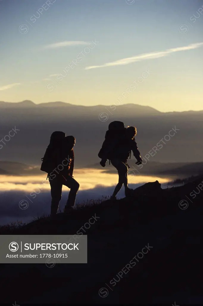 A Couple Hiking Above the Clouds