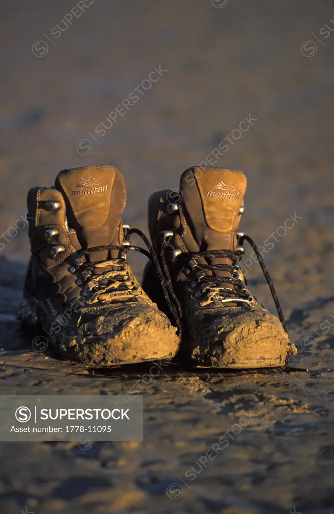 A pair of muddy boots in the desert