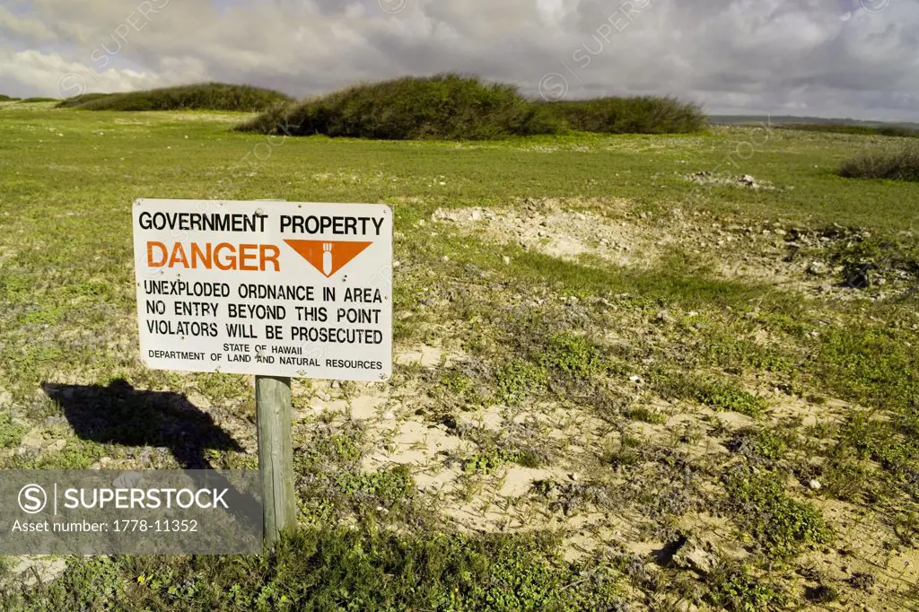 A sign warns of dangerous unexploded ordnance at Ilio point on the pacific island of Molokai, Hawaii
