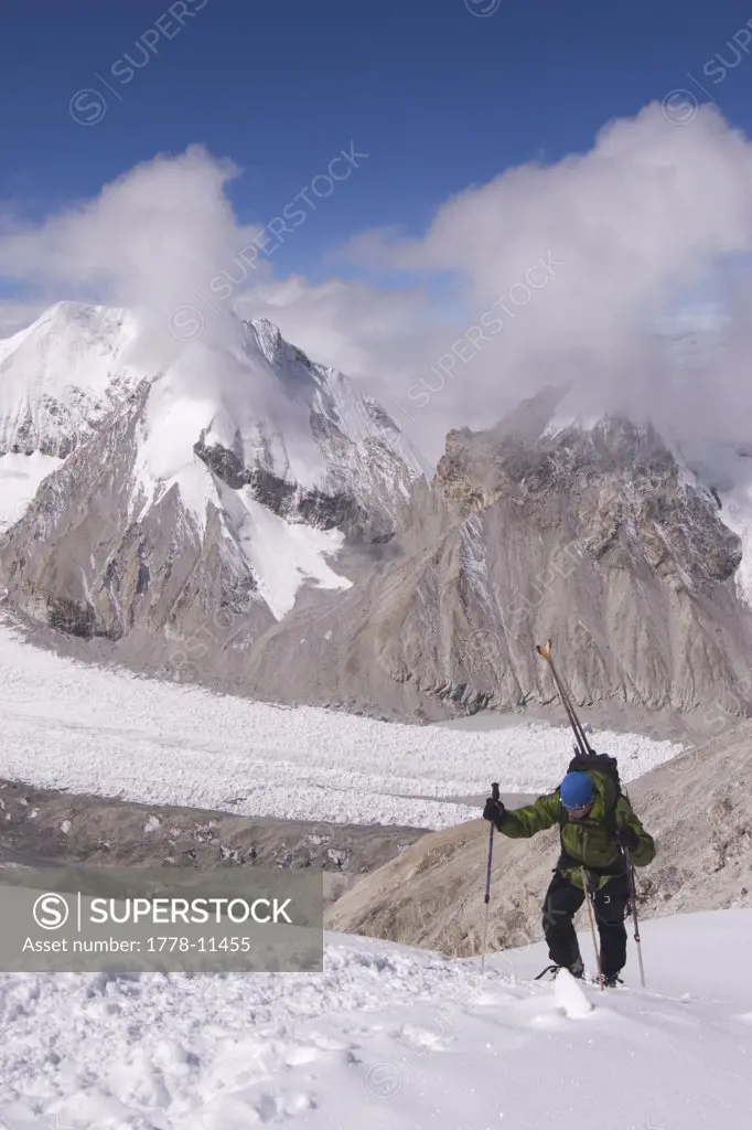 A Man Climbing With Skis on a Mountain the Himalaya