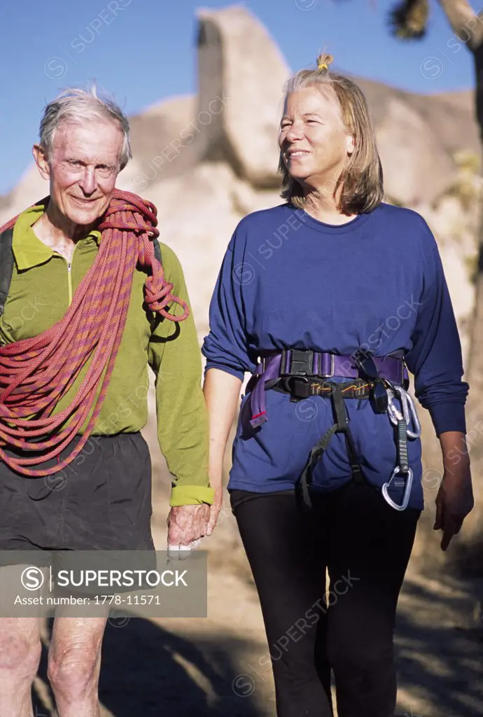 A mature couple enjoys the adventure of rock climbing