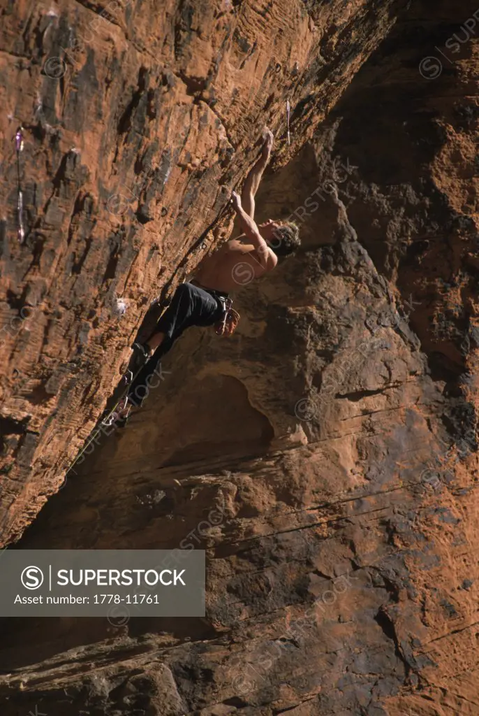 Rock climber on Nothing Shocking Red Rocks, Nevada, USA