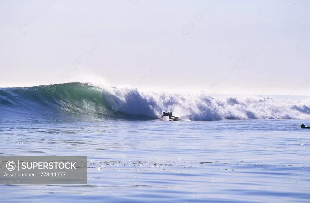 A surfer enjoys a clean swell in Santa Barbara, California