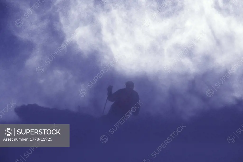 A man skiing powder snow at Squaw Valley in California
