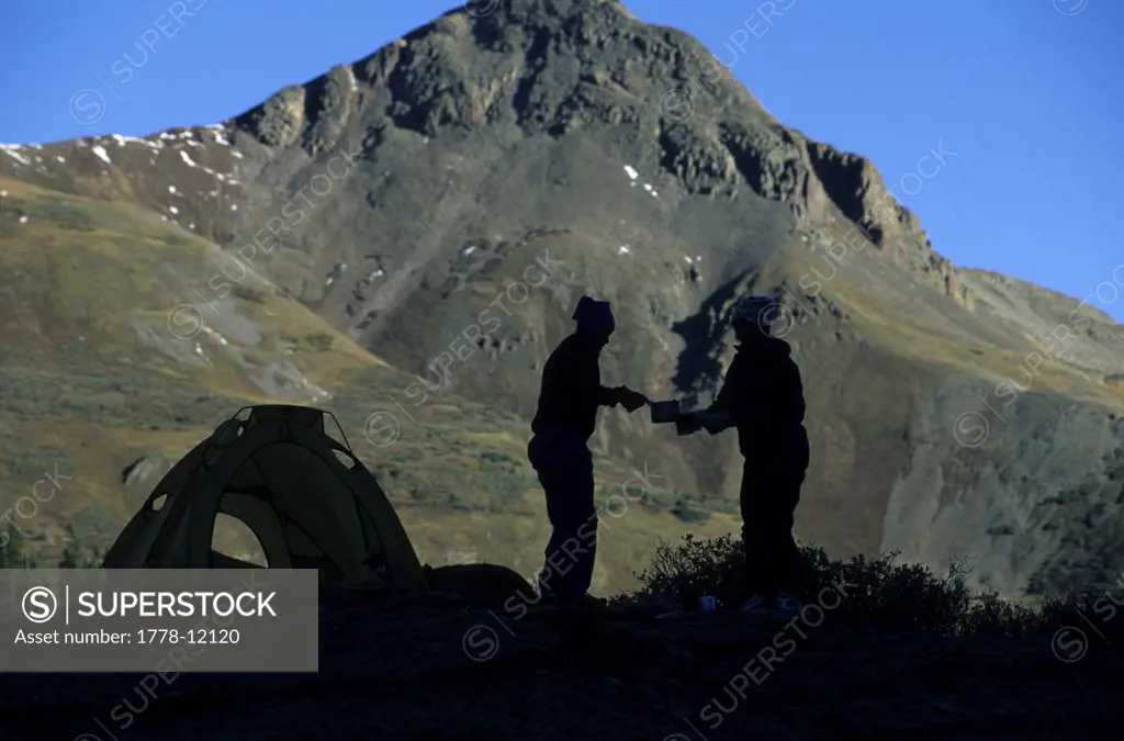 Silhouette of two people camping on the Colorado trail, Colorado