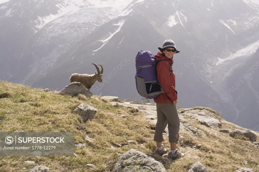 A woman and an ibex near Mont Blanc in the French Alps
