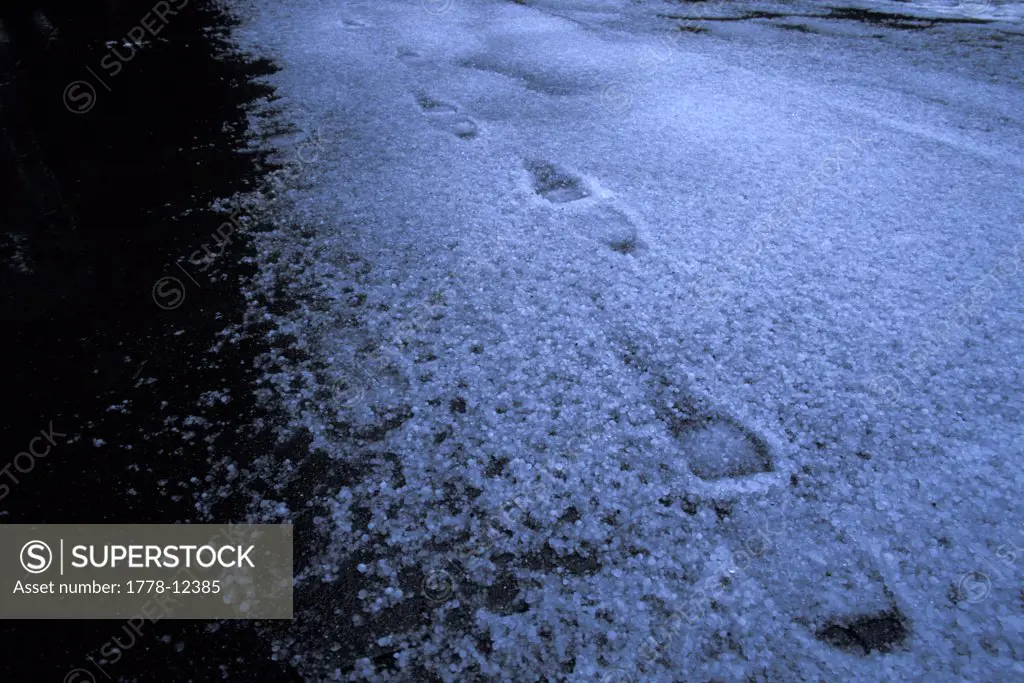 Footprints in hail after storm in Sacramento, California