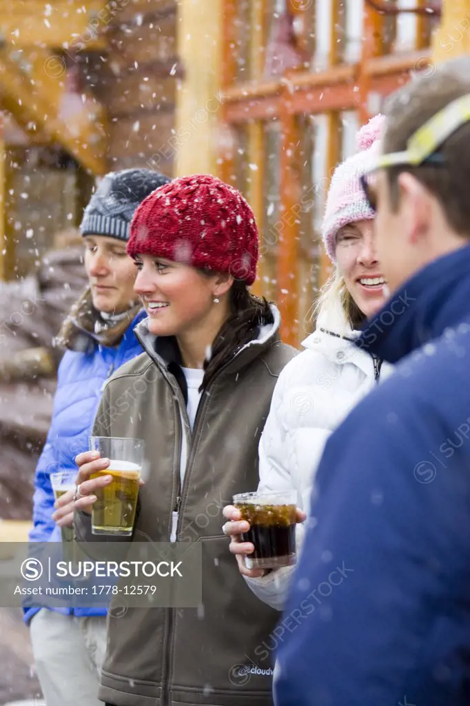 Group outside of bar in winter-snowing, Wyoming