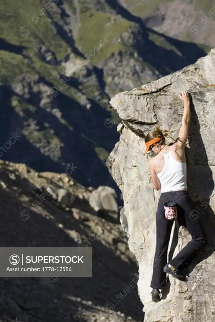 Woman rock climbing, India