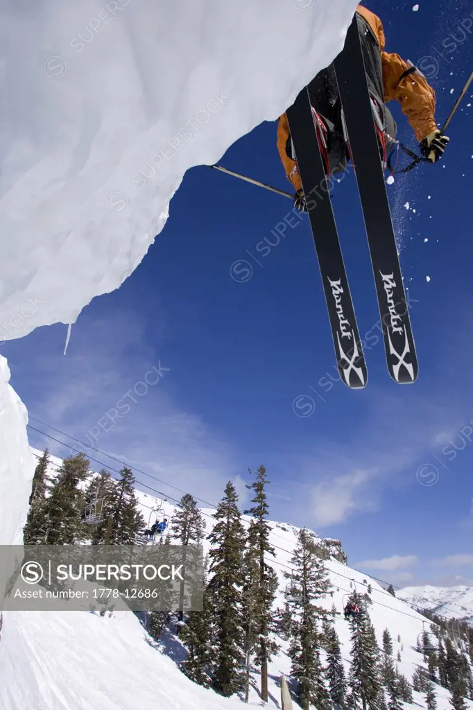 A skier jumps off of a cliff in Kirkwood, California