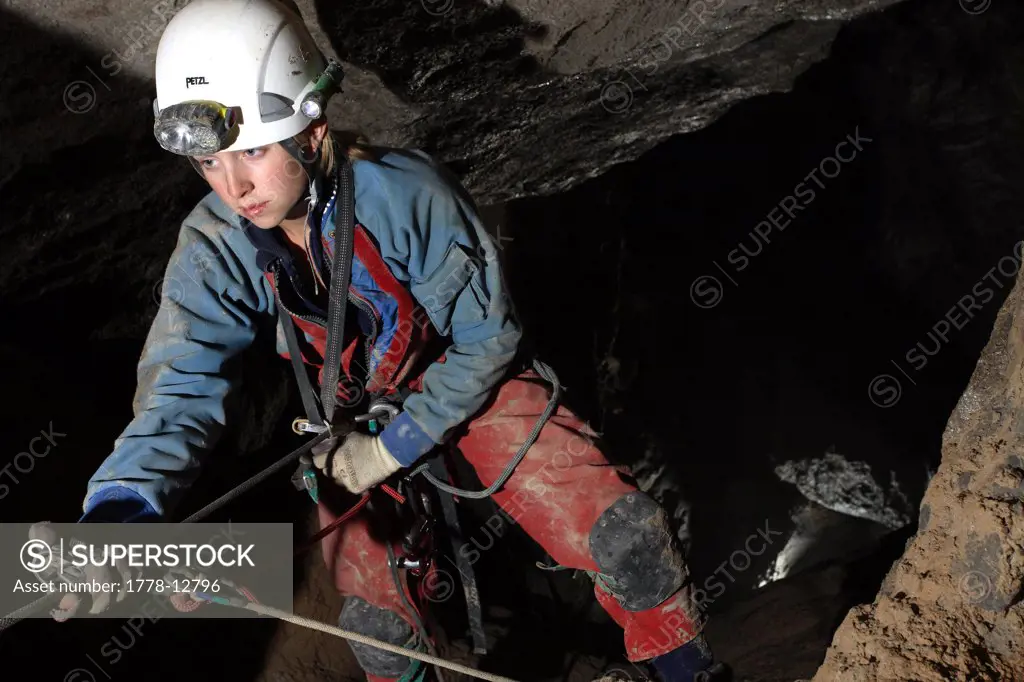 Katie Dent climbs up a rope in a cave in the White Mountains on Crete