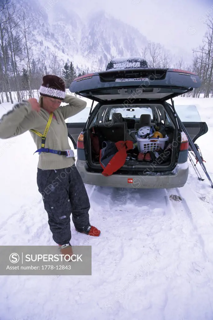 Telemark skier prepping for backcountry expedition in the Wasatch Mountains of Utah