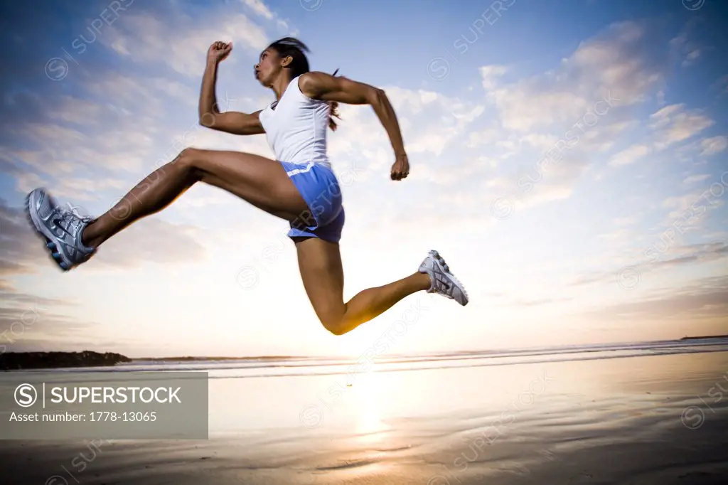 A woman runs in athletic gear in Oceanside, California