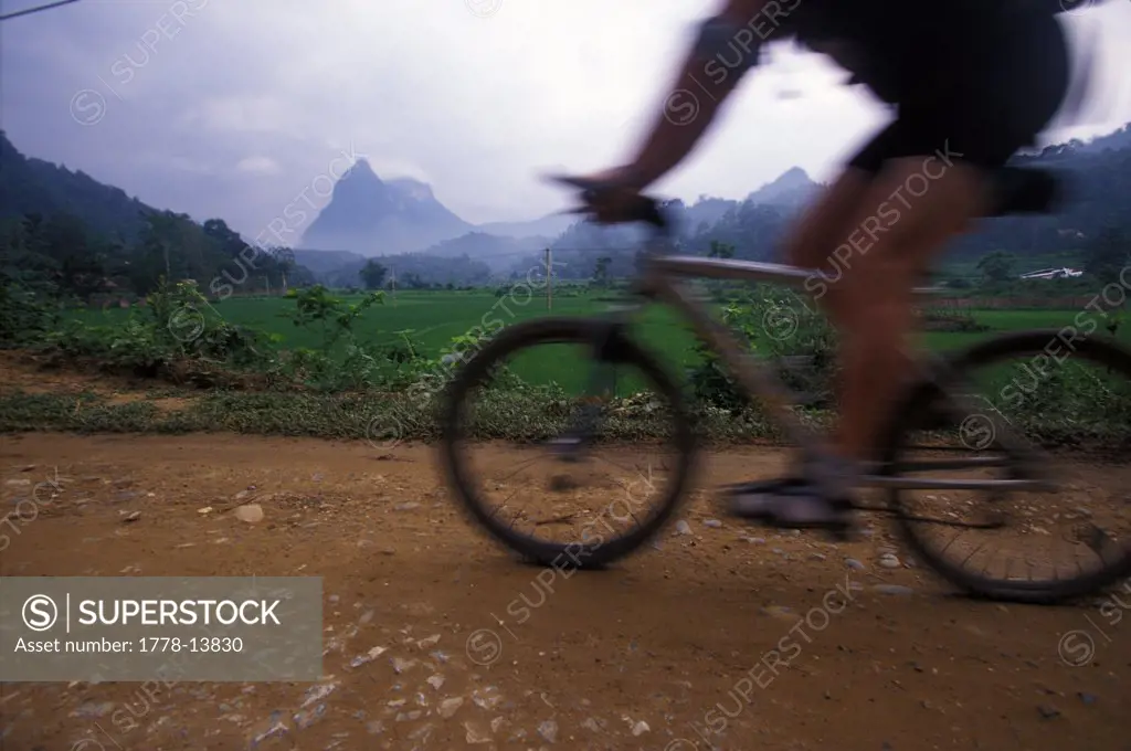 A mountain biker rides by during an adventure race in norther Vietnam (Motion Blur)