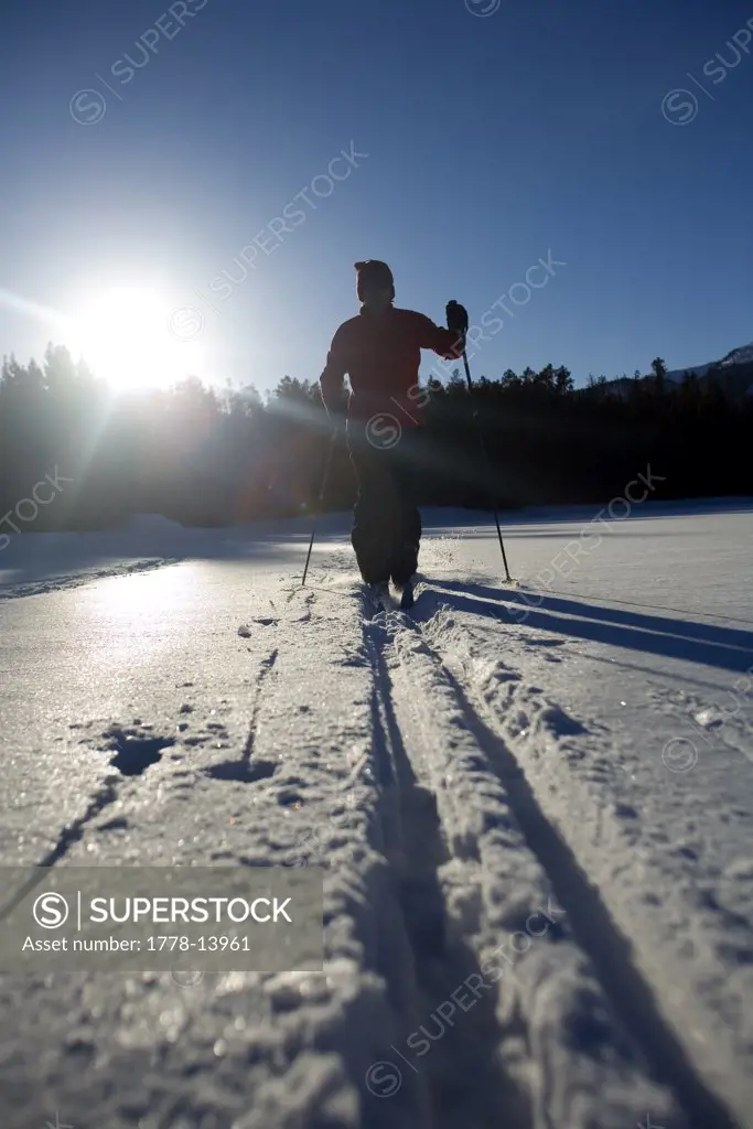 Young man cross country skiing