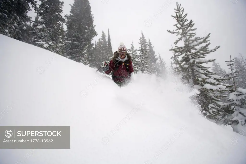 Woman telemark skiing in Vail, Colorado