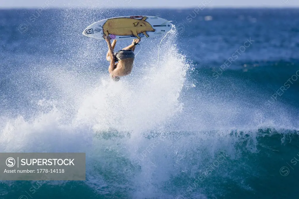 surfer performing an ariel manoeuvre, Hawaii