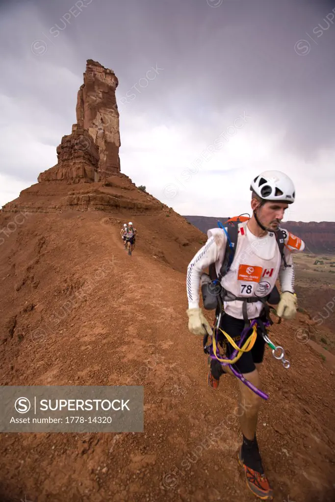Adventure racers running along a ridge in a race in Moab, Utah