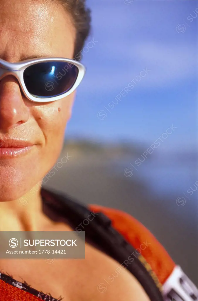 Portrait of female adventure racer on the beach in Zuma Beach, California