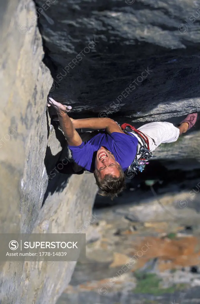 Man climbing a big granite wall