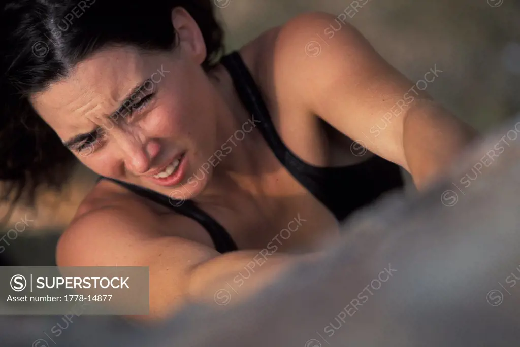 High angle perspective of a woman bouldering