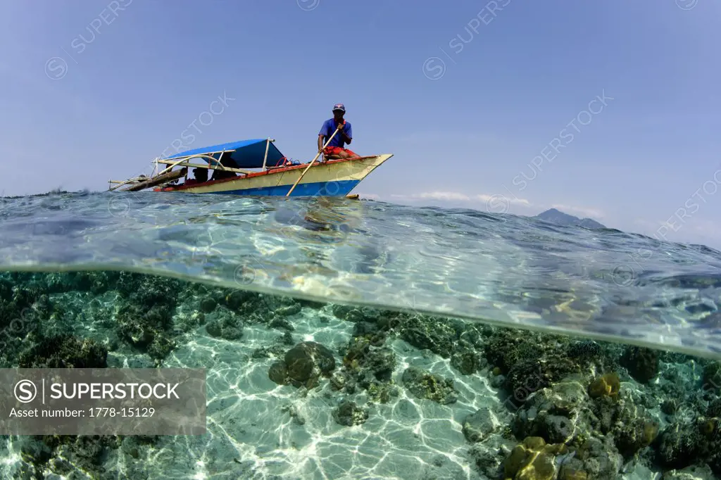 Local fisherman on skiff, Indonesia
