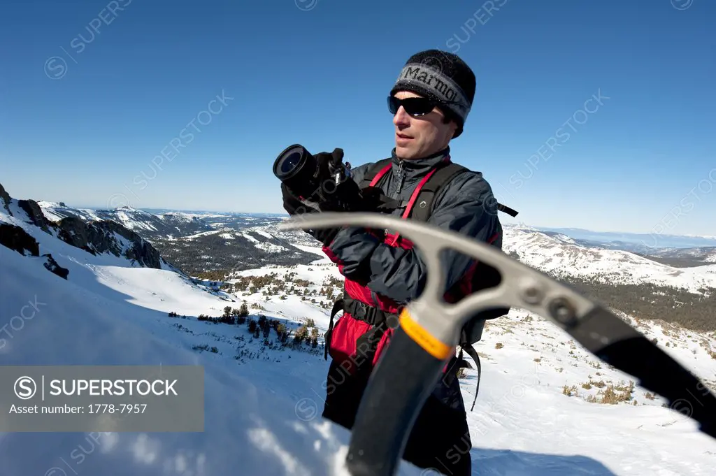 A photographer photographs a skier