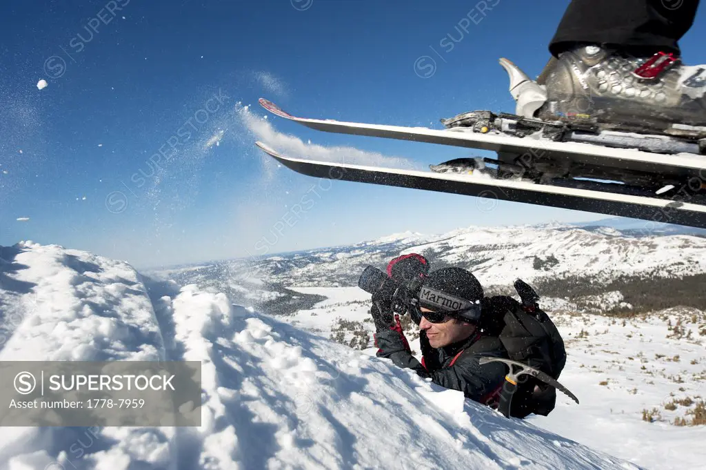 A photographer photographs a skier