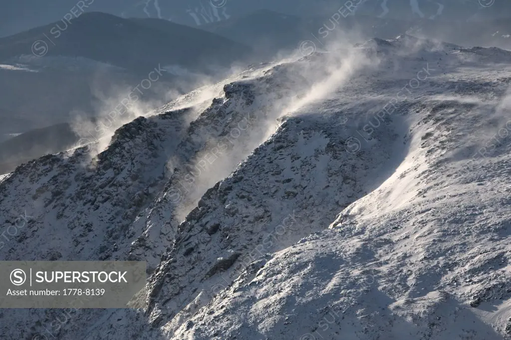 Mist rises from the rocky, snow covered slopes of Mt Washington in the White Mountains of New Hampshire