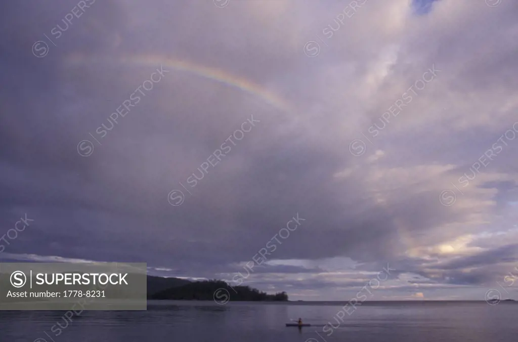 Kayaking under rainbow