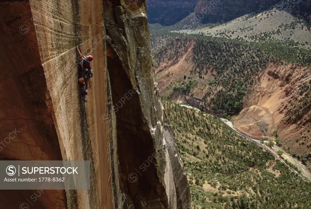 Big Wall Aid climber on a vertical wall in Zion National Park, Utah