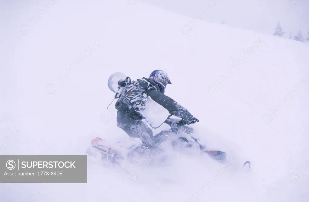snowboarder on snowmobile in deep snow